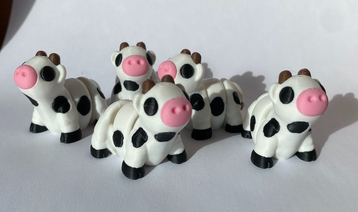 3D Printed Articulated Fidget Cows And Strawberry Cows